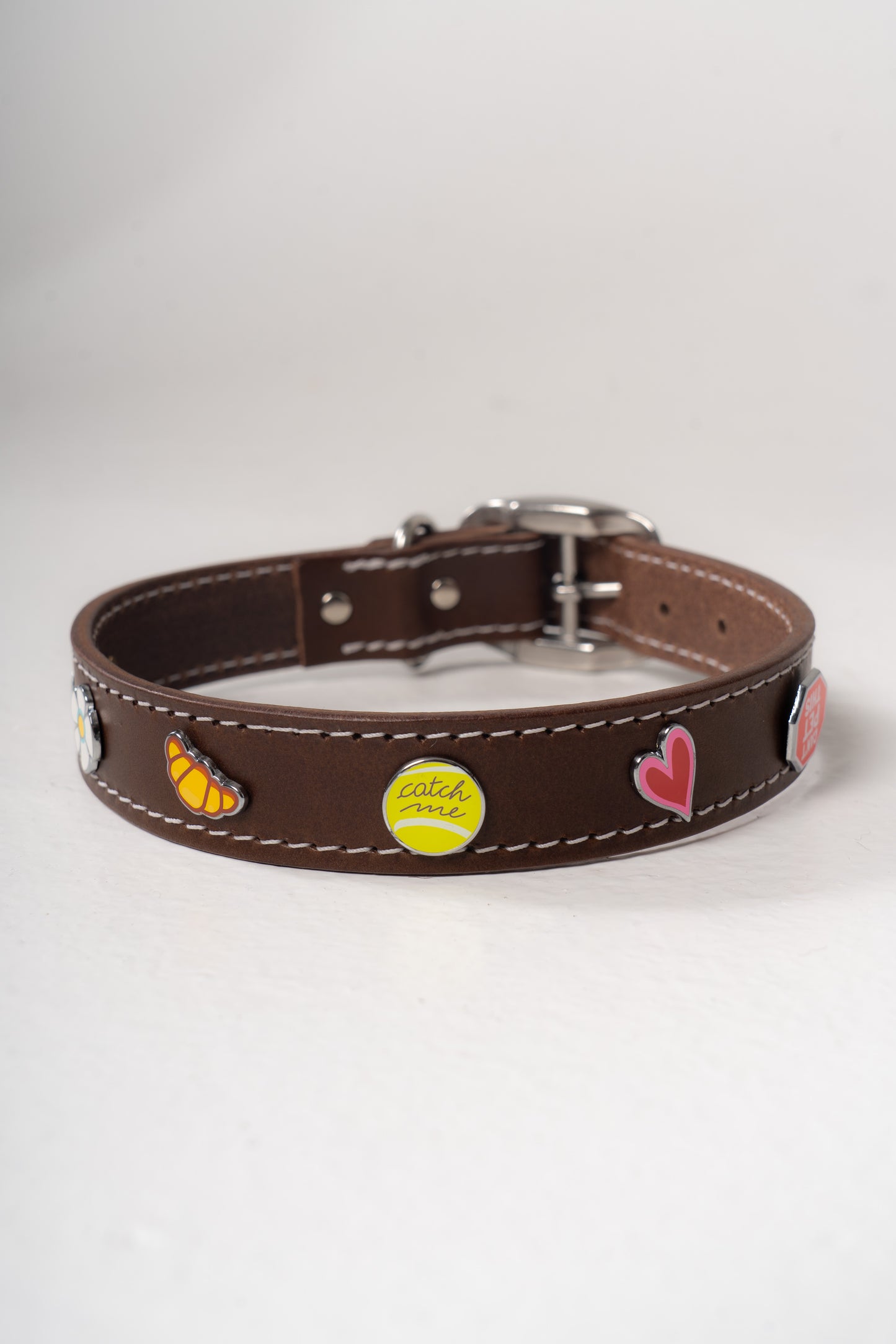 Handcrafted luxury leather collar by Mou Mou Couture with removable charms displayed on white background