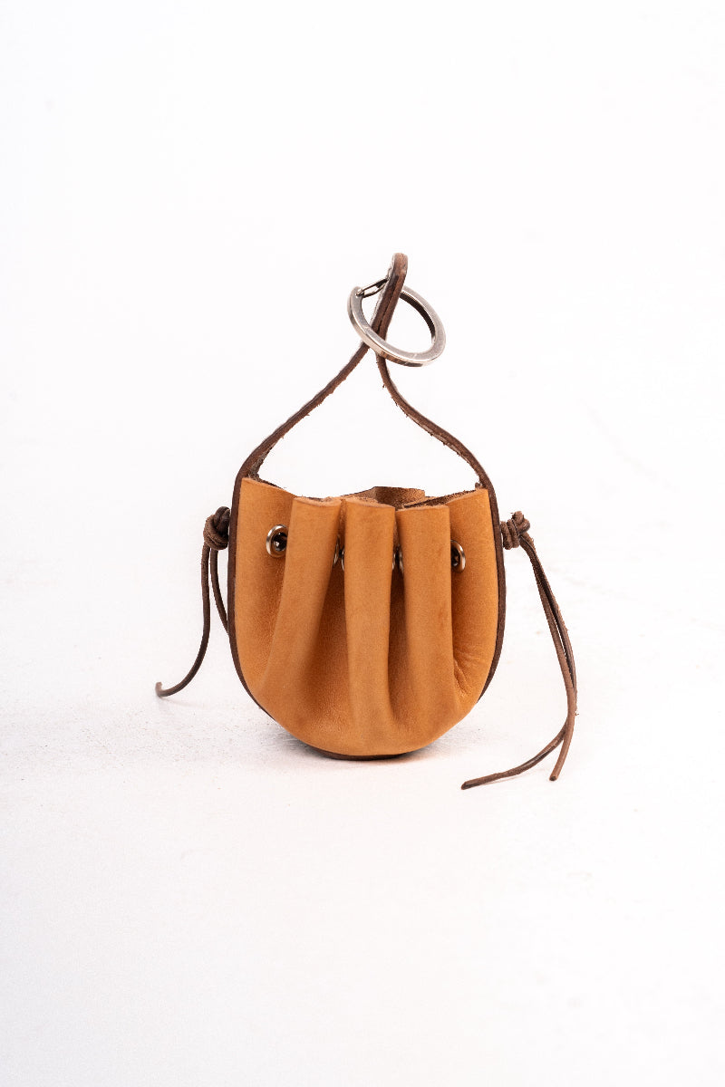 Handmade leather dog pouch for sanitary bags or treats from Mou Mou Couture displayed on a white background