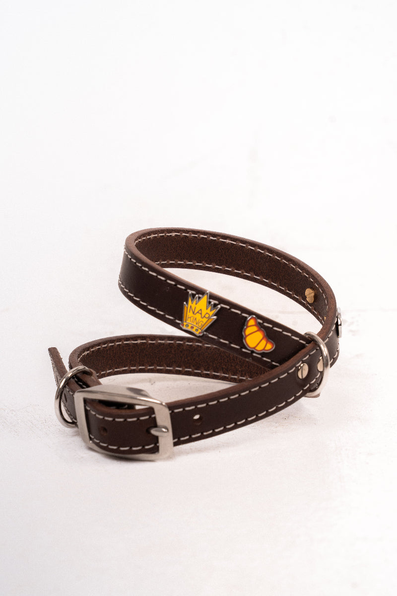 Handcrafted luxury dog harness with removable metal charms by Mou Mou Couture displayed on a white background