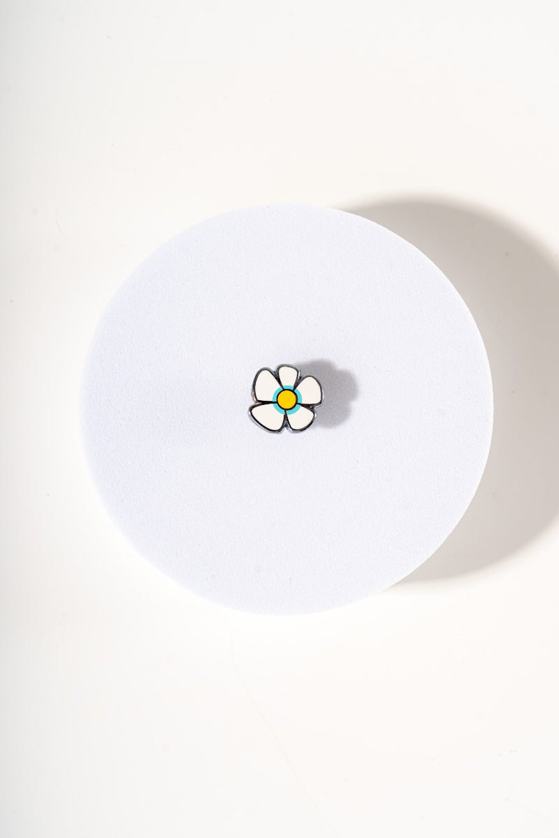 Removable metal flower shaped charm for dog's collar original design by Mou Mou Couture displayed on white background.