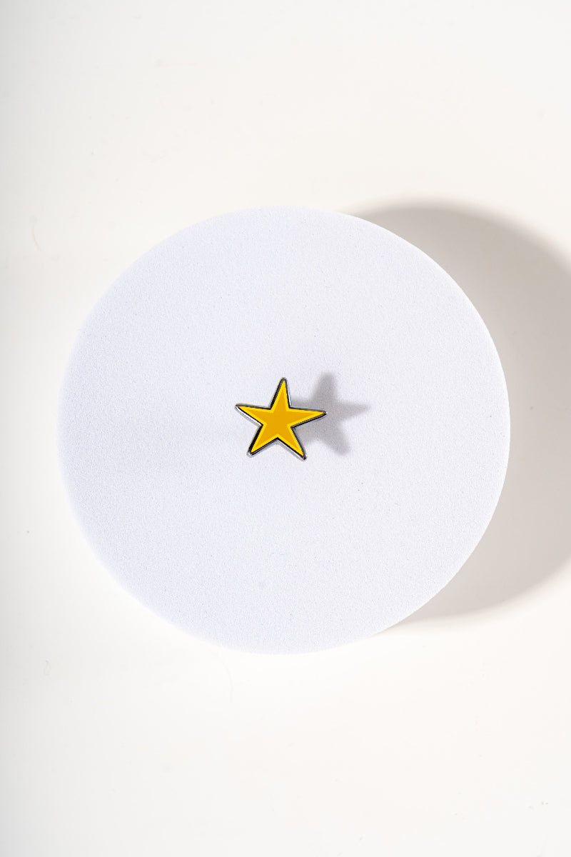 Removable metal star shaped charm for dog's collar original design by Mou Mou Couture displayed on white background.