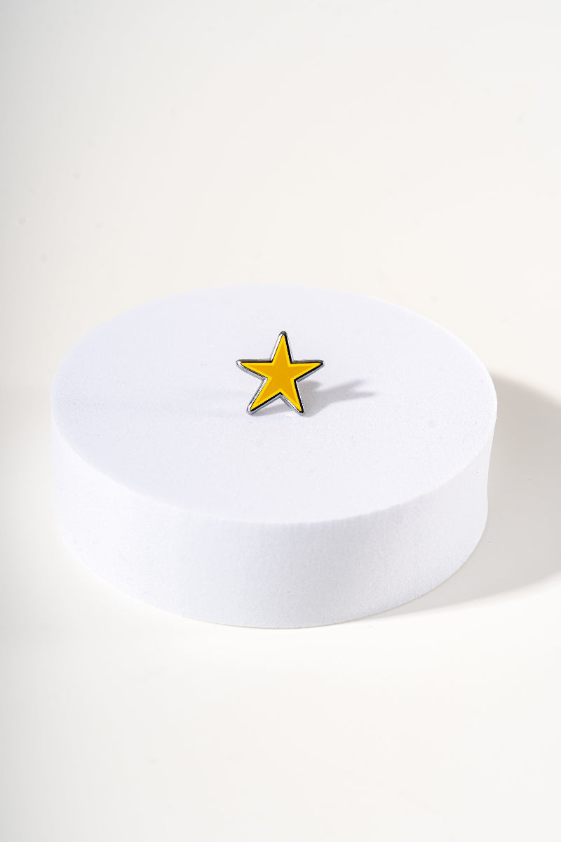 Removable metal star shaped charm for dog's collar original design by Mou Mou Couture displayed on white background.