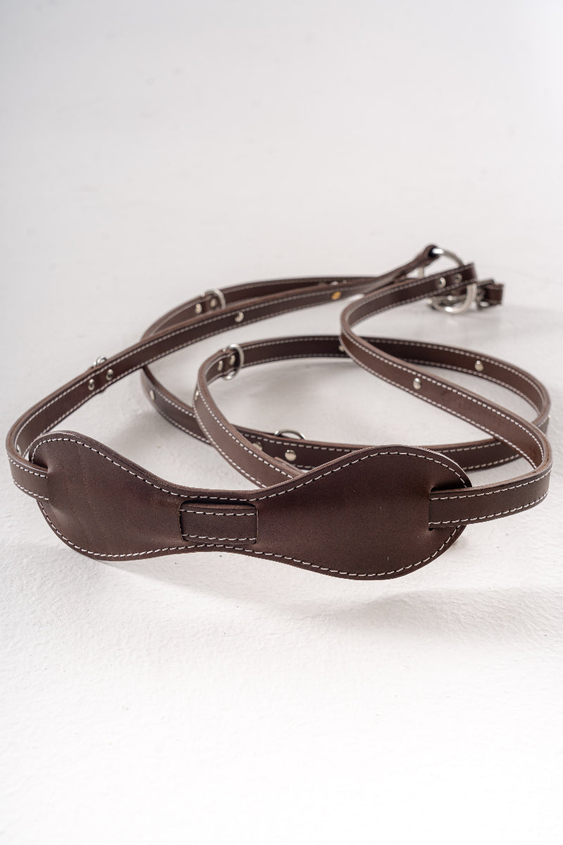 Handcrafted leather leash for dogs detail of crossbody with shoulder pad for comfort while wearing by Mou Mou Couture displayed on a white background