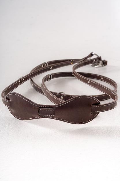Handcrafted leather leash for dogs detail of crossbody with shoulder pad for comfort while wearing by Mou Mou Couture displayed on a white background