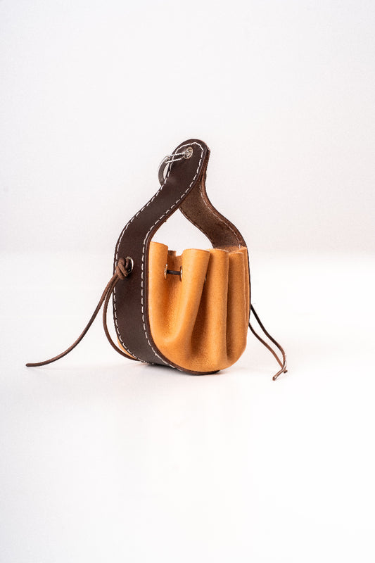Handmade leather dog pouch for sanitary bags or treats from Mou Mou Couture displayed on a white background