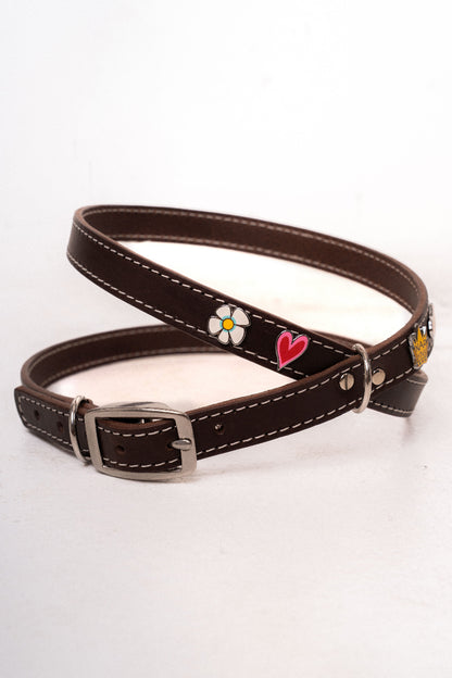 Handcrafted luxury dog harness with removable metal charms by Mou Mou Couture displayed on a white background