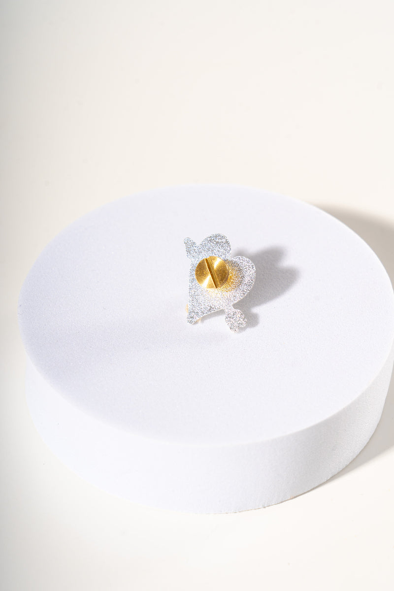 Metal removable charm for dog collar by Mou Mou Couture detail on screw closure displayed on white background