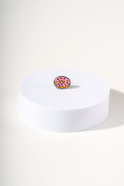 Removable metal donut shaped charm for dog's collar original design by Mou Mou Couture displayed on white background.
