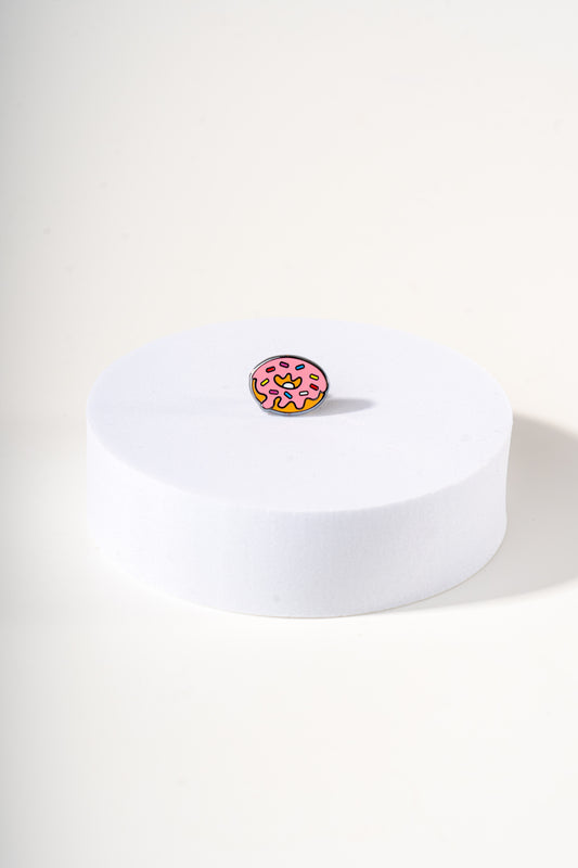 Removable metal donut shaped charm for dog's collar original design by Mou Mou Couture displayed on white background.
