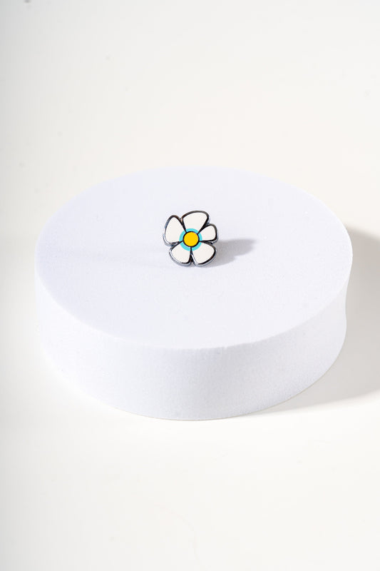 Removable metal flower shaped charm for dog's collar original design by Mou Mou Couture displayed on white background.